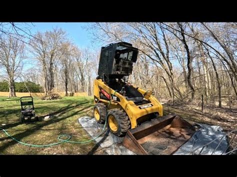 track skid steer belly washing